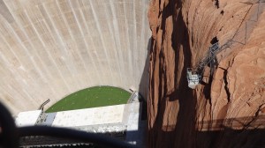 Glen Canyon dam. Bus loads of folks stream across the bridge to get a closer look.