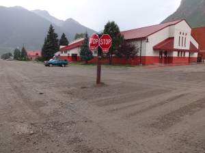 Put a post with 4 stop signs on it in the .iddle of the intersection.